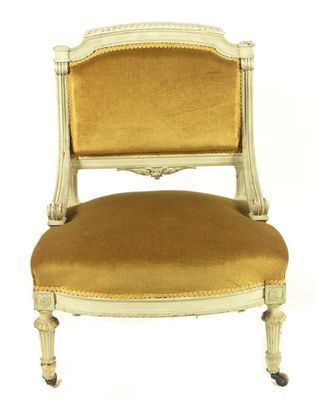 Appraisal: A late th century painted nursing chair the padded back