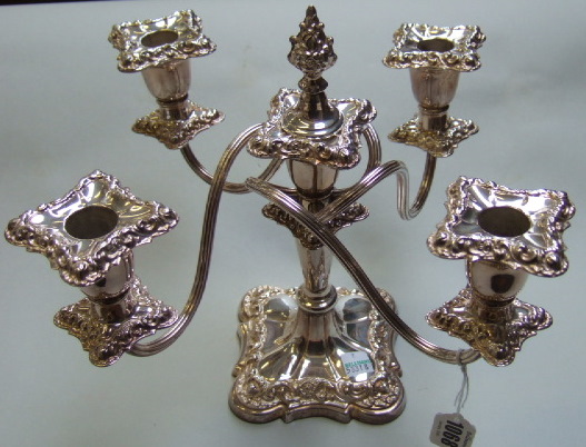 Appraisal: A plated five light candelabra the centre with a flame