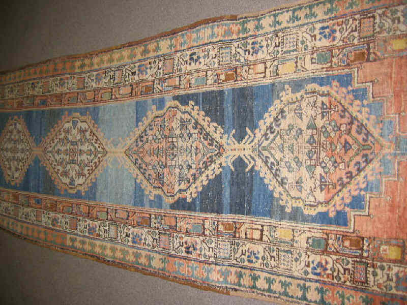 Appraisal: SARAB LONG RUG The abrashed navy blue field centers a