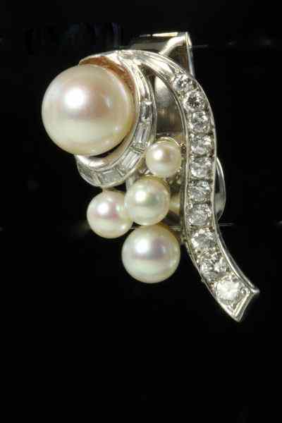 Appraisal: Pearl and Diamond Earclipseach centering on one round cultured pearl