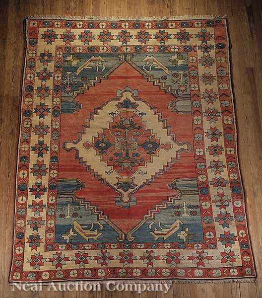 Appraisal: A Turkish Carpet red blue and cream ground central medallion