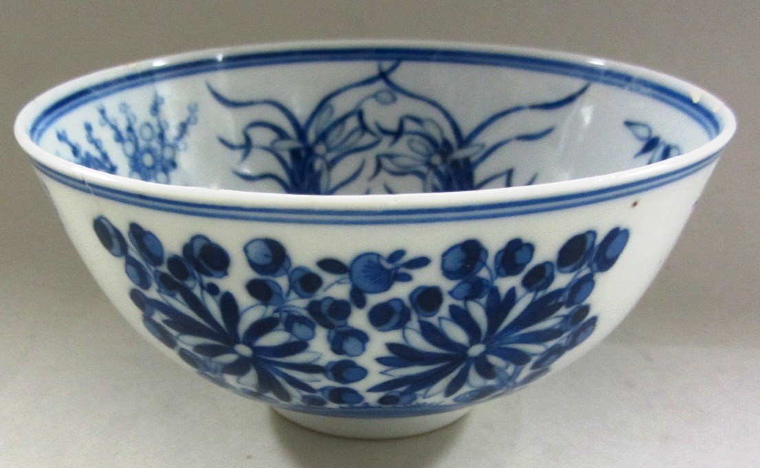 Appraisal: A Chinese blue and white rice-grain bowl painted with flowers