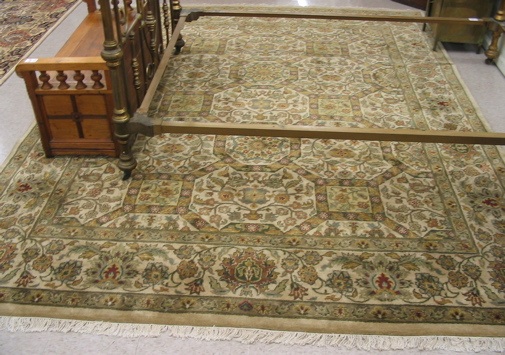 Appraisal: HAND KNOTTED ORIENTAL CARPET Indo-Persian repeating floral panel design in