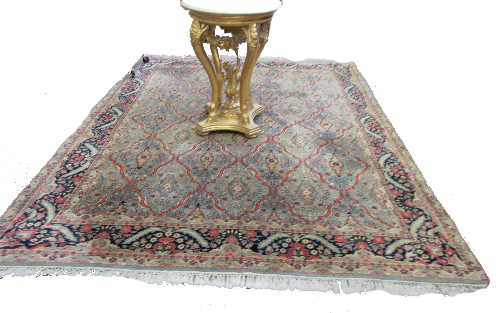 Appraisal: A Tabriz carpet Persian the sage field with a shaped