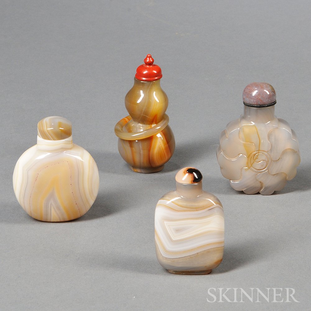 Appraisal: Four Snuff Bottles China a rounded rectangular gray agate snuff