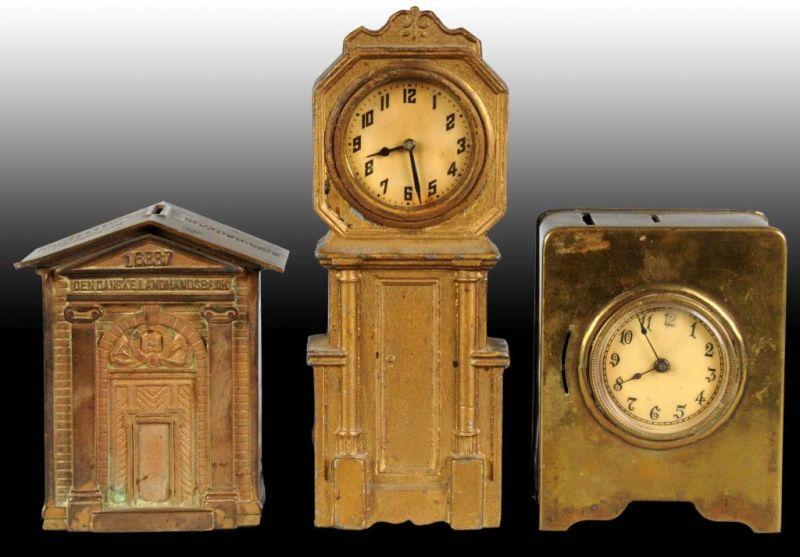 Appraisal: Lot of Still Banks Description Brass clock Cast Iron Clock