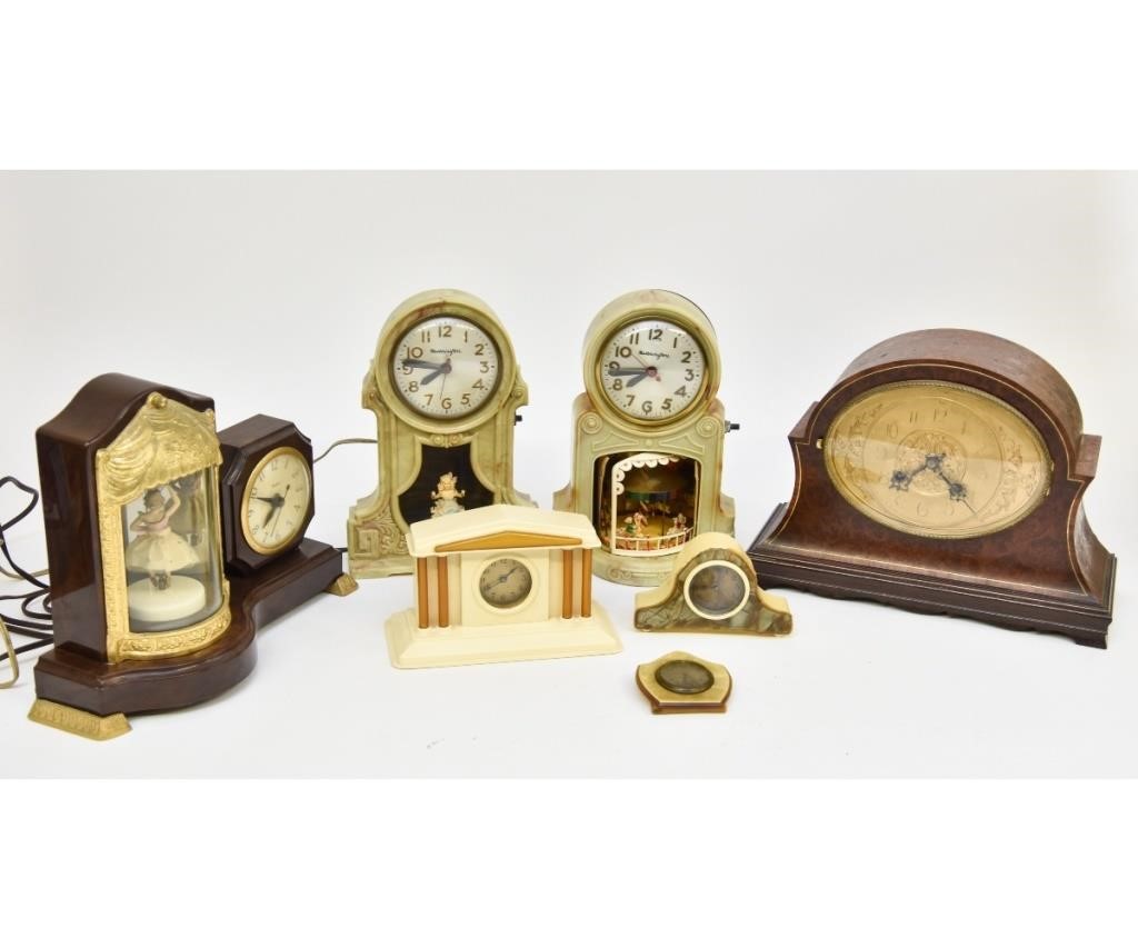 Appraisal: Seven wood plastic celluloid table clocks the largest by Franz