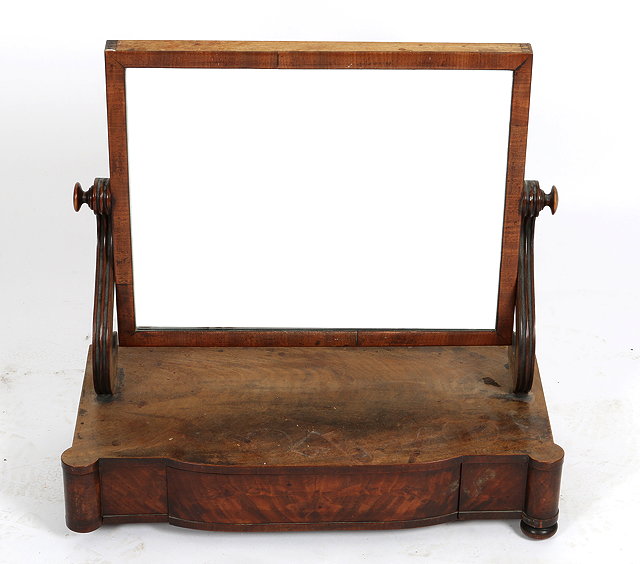 Appraisal: A VICTORIAN MAHOGANY SWING TOILET MIRROR with rectangular plate scroll