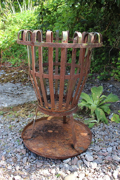 Appraisal: A WROUGHT IRON STRAPWORK BRAZIER of vase form standing on