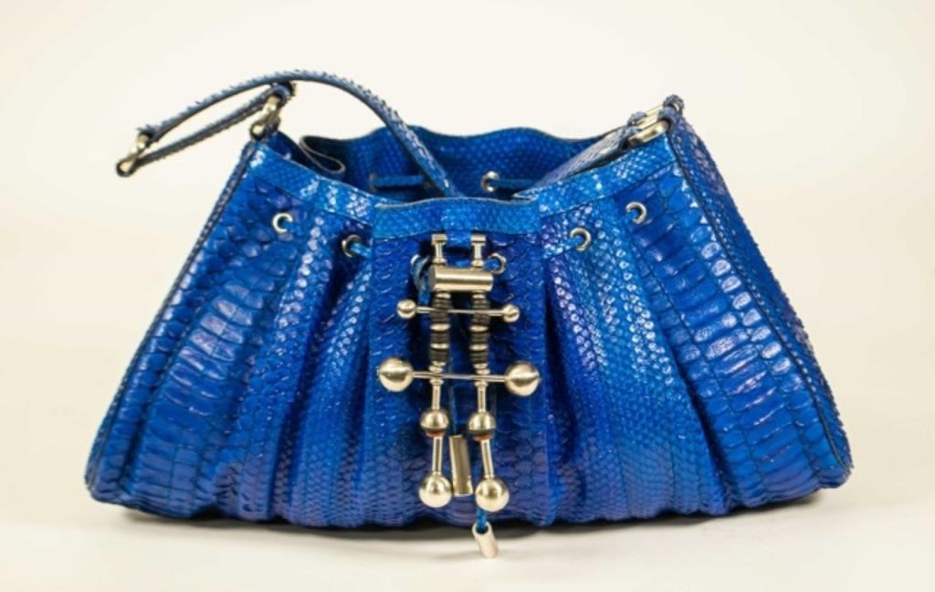 Appraisal: Donna Karan cobalt blue python bag with metal accents single