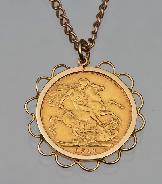 Appraisal: A GOLD PENDANT set with a gold sovereign attached to