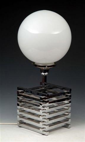 Appraisal: A CHROME PLATED TABLE LAMP the base made up of