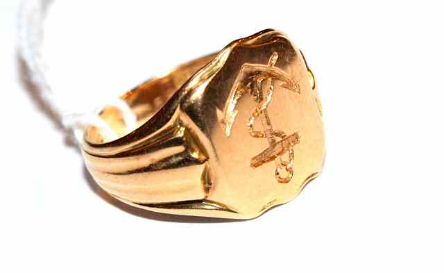 Appraisal: AN CT GOLD SIGNET RING with shield shaped top engraved