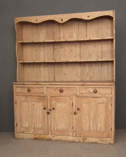 Appraisal: A th Century stripped pine dresser the upper part with