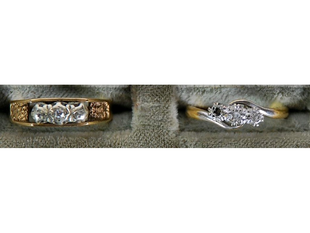 Appraisal: ct GOLD AND PLATINUM CROSS OVER RING with two tiny