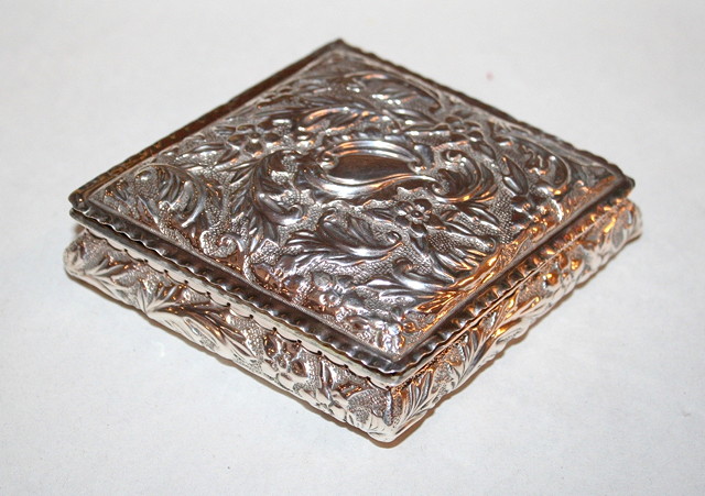 Appraisal: A LATE VICTORIAN DIAMOND SHAPED TRINKET BOX with pressed foliate