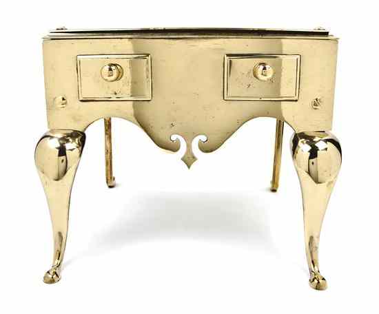 Appraisal: A Brass Footman having a rectangular top above a shaped