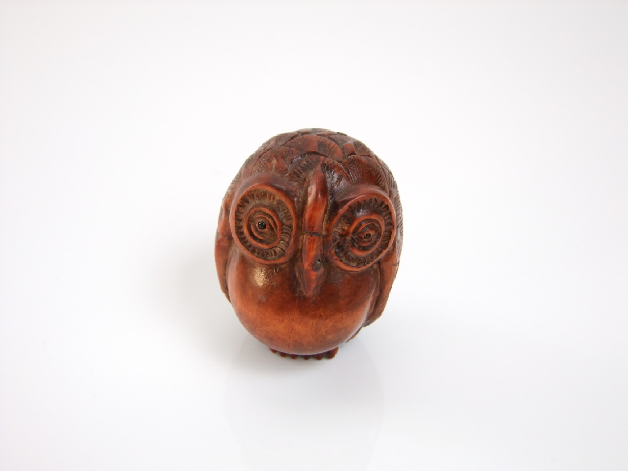 Appraisal: A carved hardwood study of a rotund owl