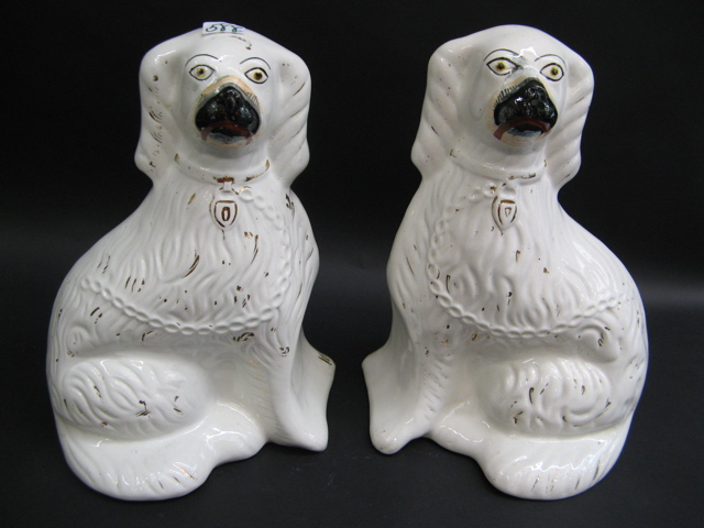 Appraisal: PAIR IRONSTONE MODELS OF STAFFORDSHIRE DOGS English gold decorated on