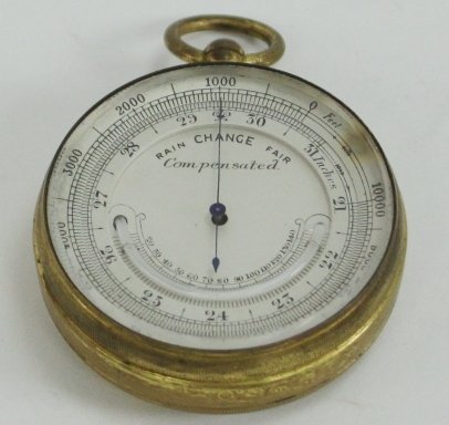 Appraisal: A pocket compensated barometer with crescent shaped mercury thermometer in