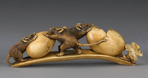 Appraisal: An ivory okimono Carved and incised as a group of