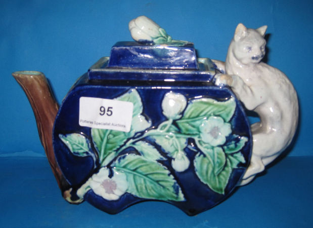 Appraisal: th Century Minton Majolica Cat teapot with embossed flowes restored