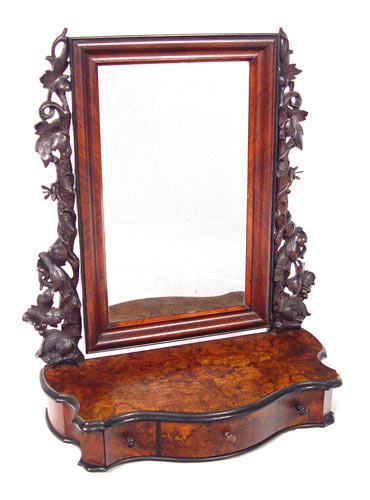 Appraisal: TH C CARVED MAHOGANY SHAVING MIRROR Finely carved naturalistic leaf