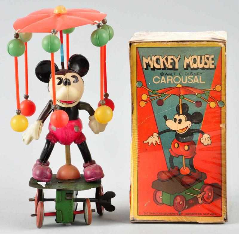 Appraisal: Celluloid Disney Mickey Carousel Wind-Up Toy Description Japanese Circa s