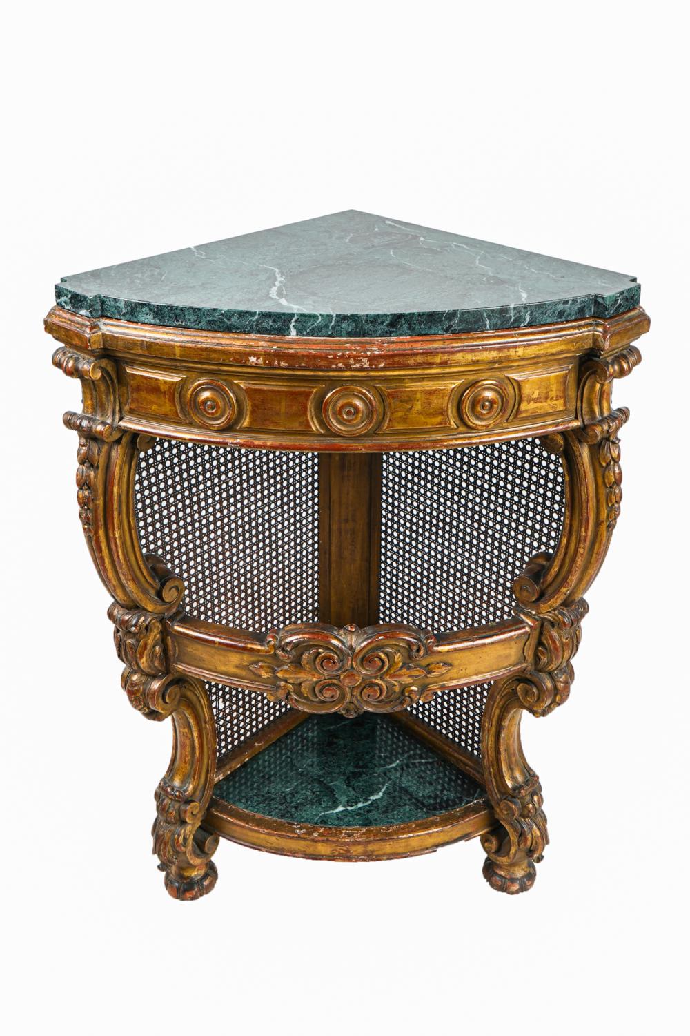 Appraisal: VENETIAN GILT DECORATED MARBLE TOP CORNER TABLEwith a cane backing