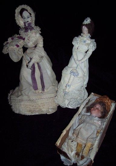 Appraisal: A doll with a cloth head carrying a parasol another