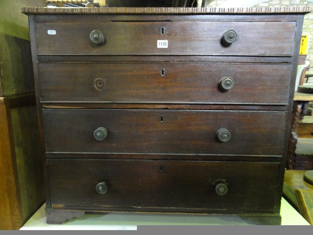 Appraisal: A Georgian mahogany chest fitted with an arrangement of four