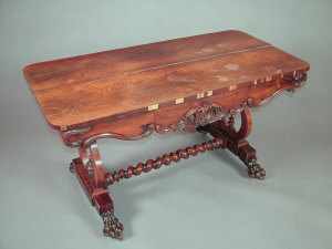 Appraisal: An early Victorian rosewood library table the applied decorated scroll