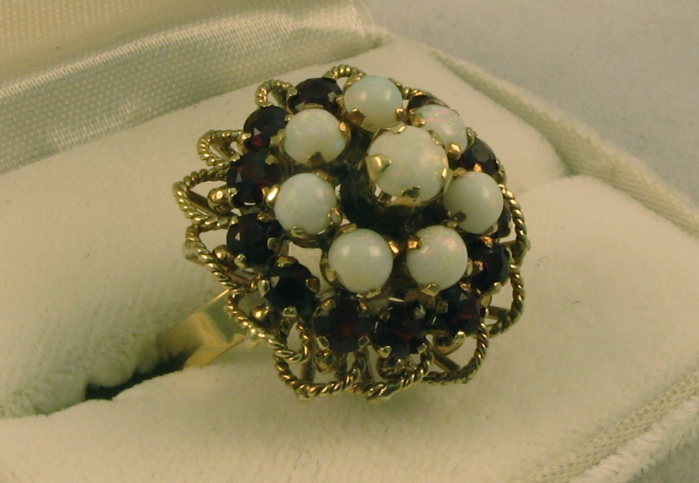 Appraisal: GARNET OPAL AND FOURTEEN KARAT CLUSTER RING set with eight