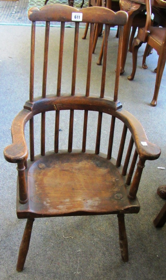 Appraisal: A th century ash and elm child's comb back chair