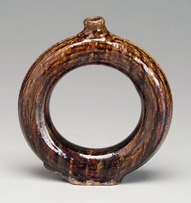 Appraisal: Stoneware ring jug mottled dark brown alkaline glaze incised concentric