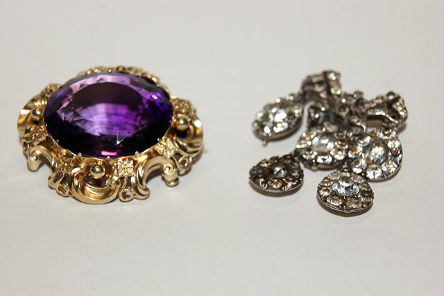 Appraisal: AN AMETHYST BROOCH in stylised frame together with a paste