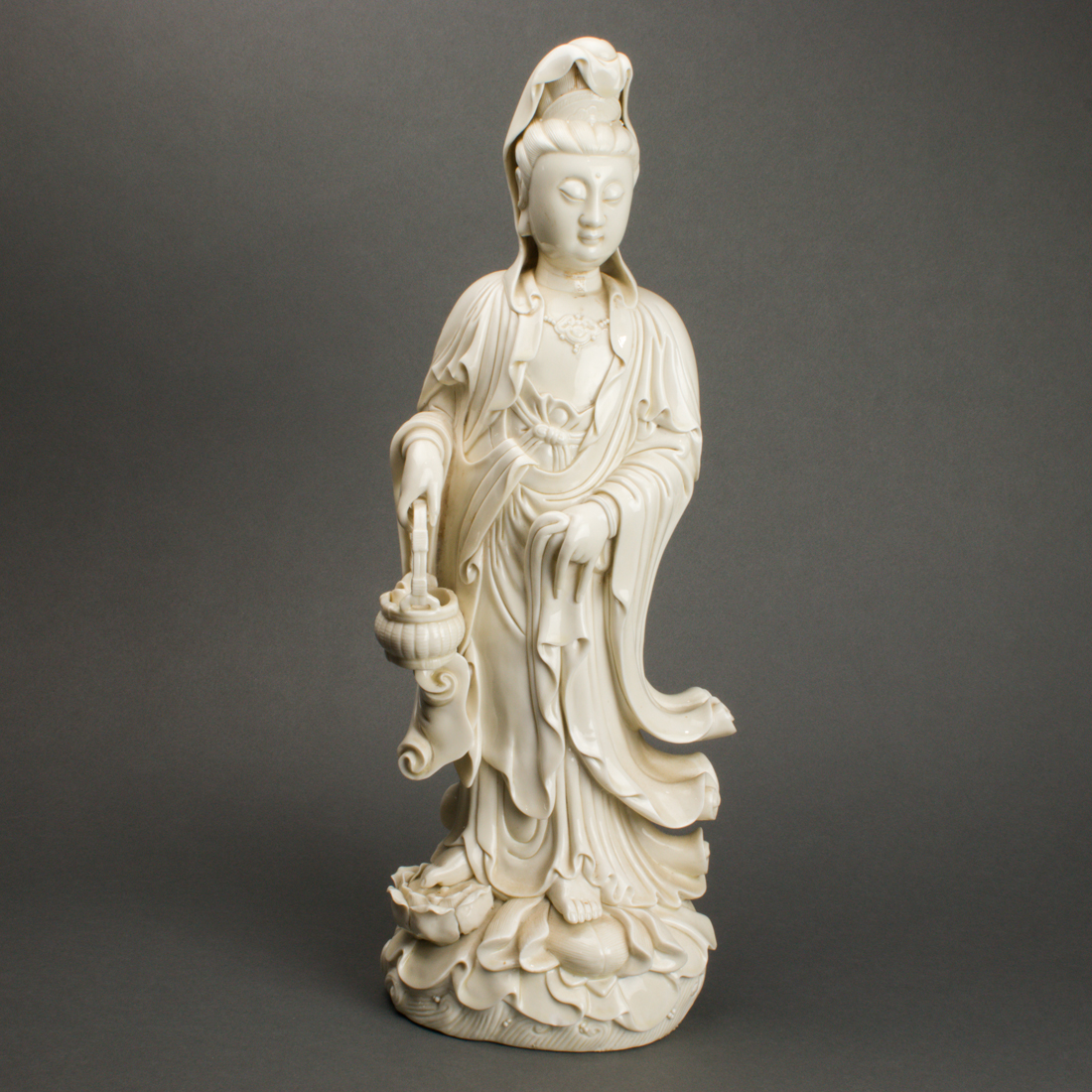 Appraisal: CHINESE DEHUA FIGURE OF GUANYIN Chinese Dehua figure of Guanyin