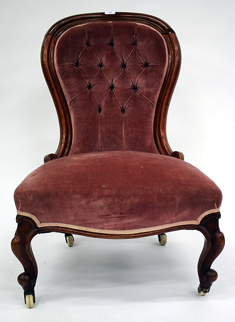 Appraisal: A VICTORIAN MAHOGANY SLIPPER CHAIR with shaped back and on