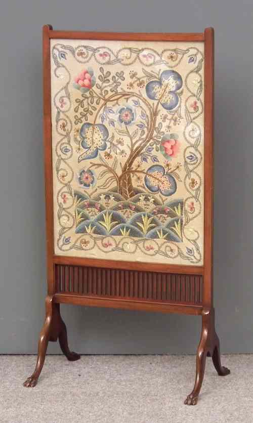 Appraisal: An Edwardian mahogany framed rectangular fire screen inset with embroidered