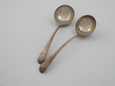 Appraisal: A pair of George III Old English sauce ladles crested