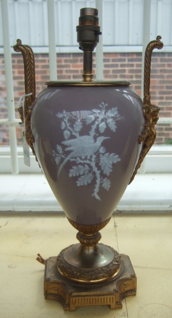 Appraisal: A gilt bronze and porcelain two handled vase lamp base