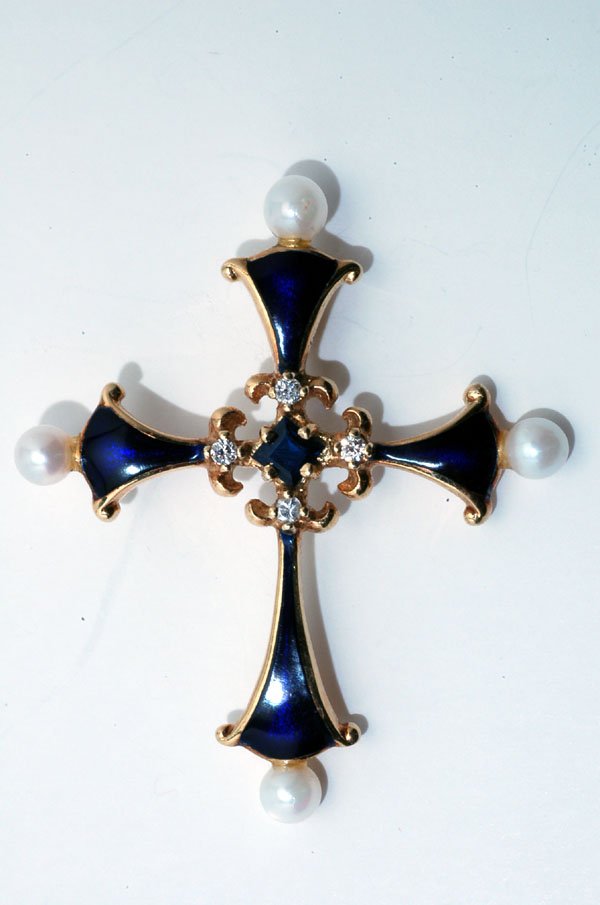 Appraisal: Stamped K yellow gold cross with center prong set blue