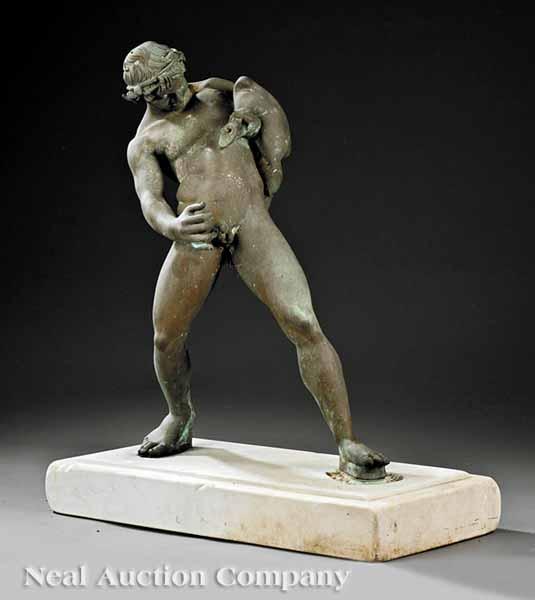 Appraisal: A Continental Patinated Bronze of Silenus depicted with a wine