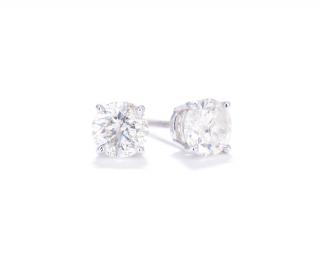 Appraisal: A PAIR OF DIAMOND SOLITAIRE EARRINGS CARAT TOTAL WEIGHT A