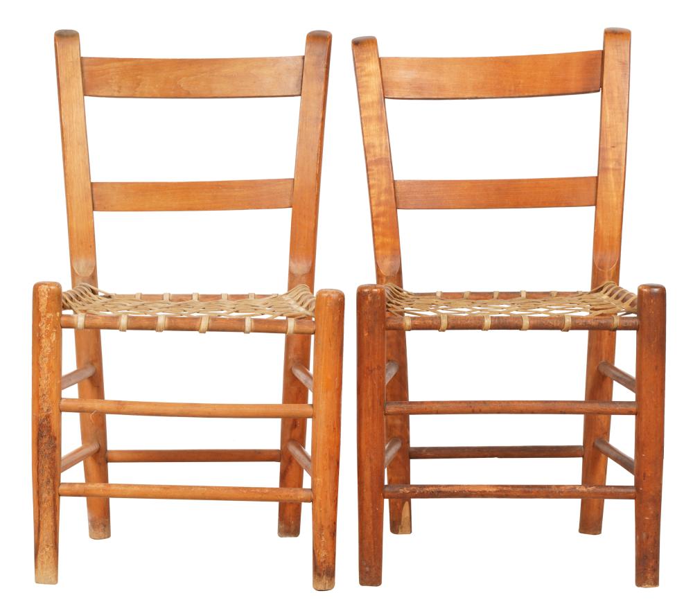 Appraisal: PAIR OF AMERICAN LADDERBACK CHAIRSwith woven hide seats inches wide