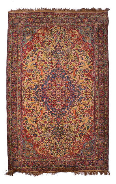 Appraisal: A PERSIAN TEHERAN MULTI-COLOURED RUG decorated a central deep blue