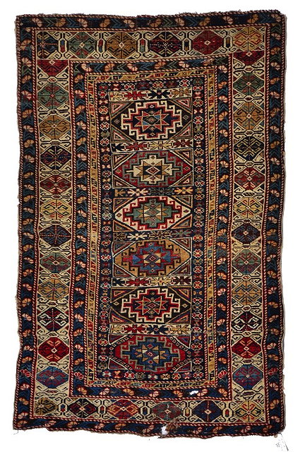 Appraisal: A SHIRVAN RUG the central panel with six hooked medallions