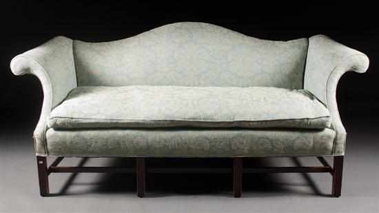 Appraisal: Chippendale style carved mahogany camelback upholstered sofa probably Kittinger th