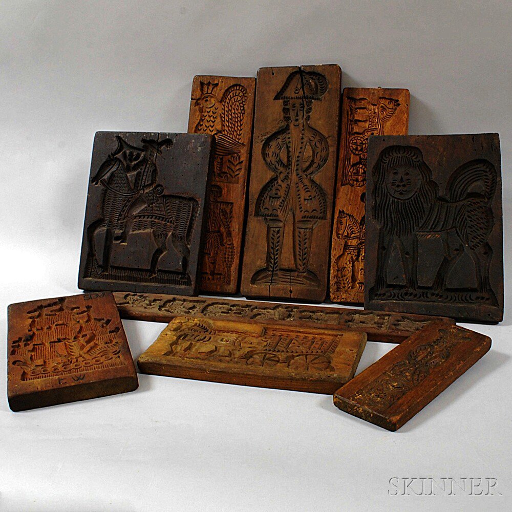 Appraisal: Nine Carved Wood Molds with shallow carvings of various figures