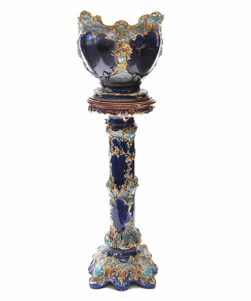 Appraisal: A Continental earthenware jardiniere on stand height ft in diameter